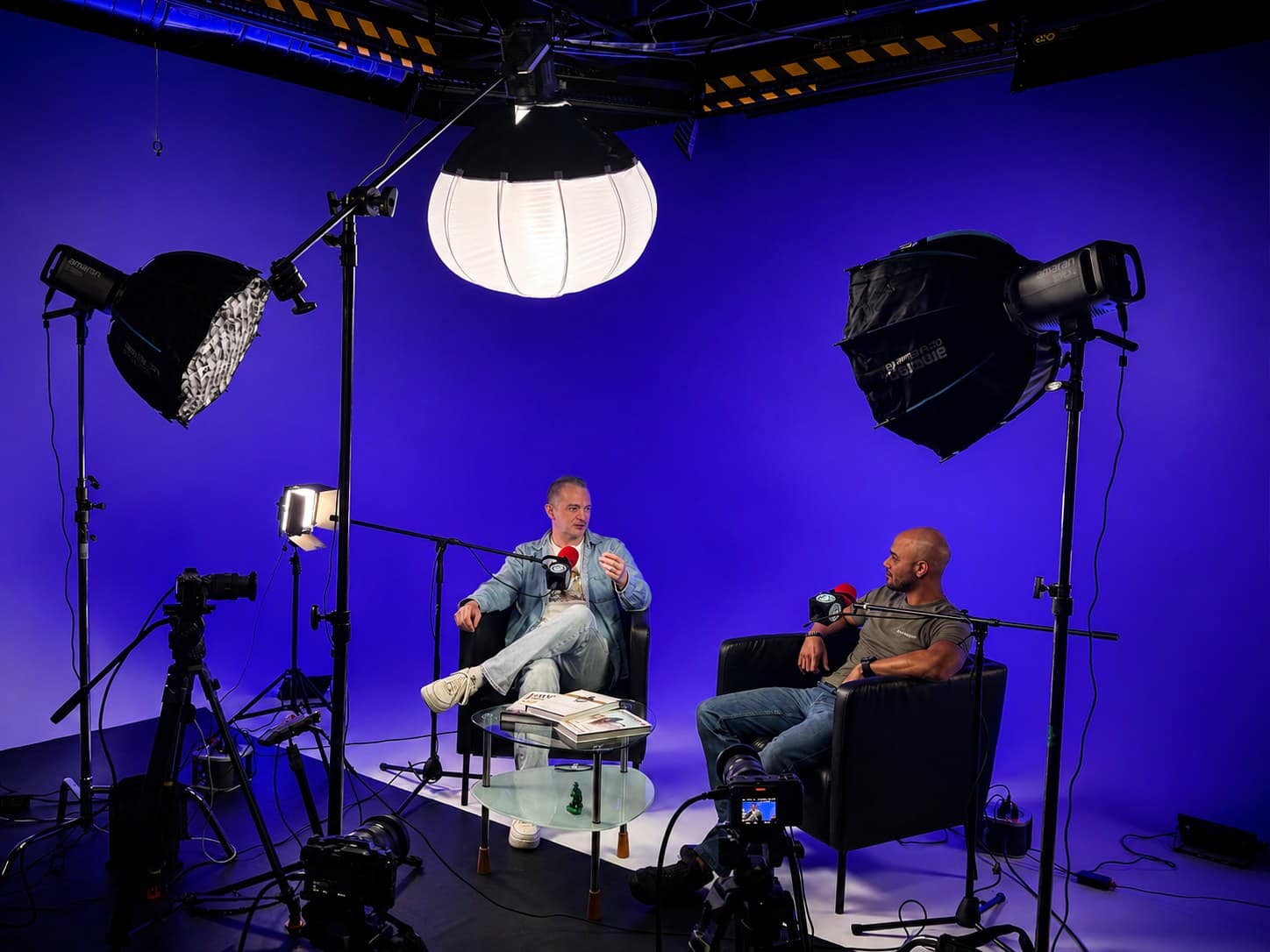 Canvas Podcast, a white cyc podcast stage with blue lighting at VibeShack Studios SF