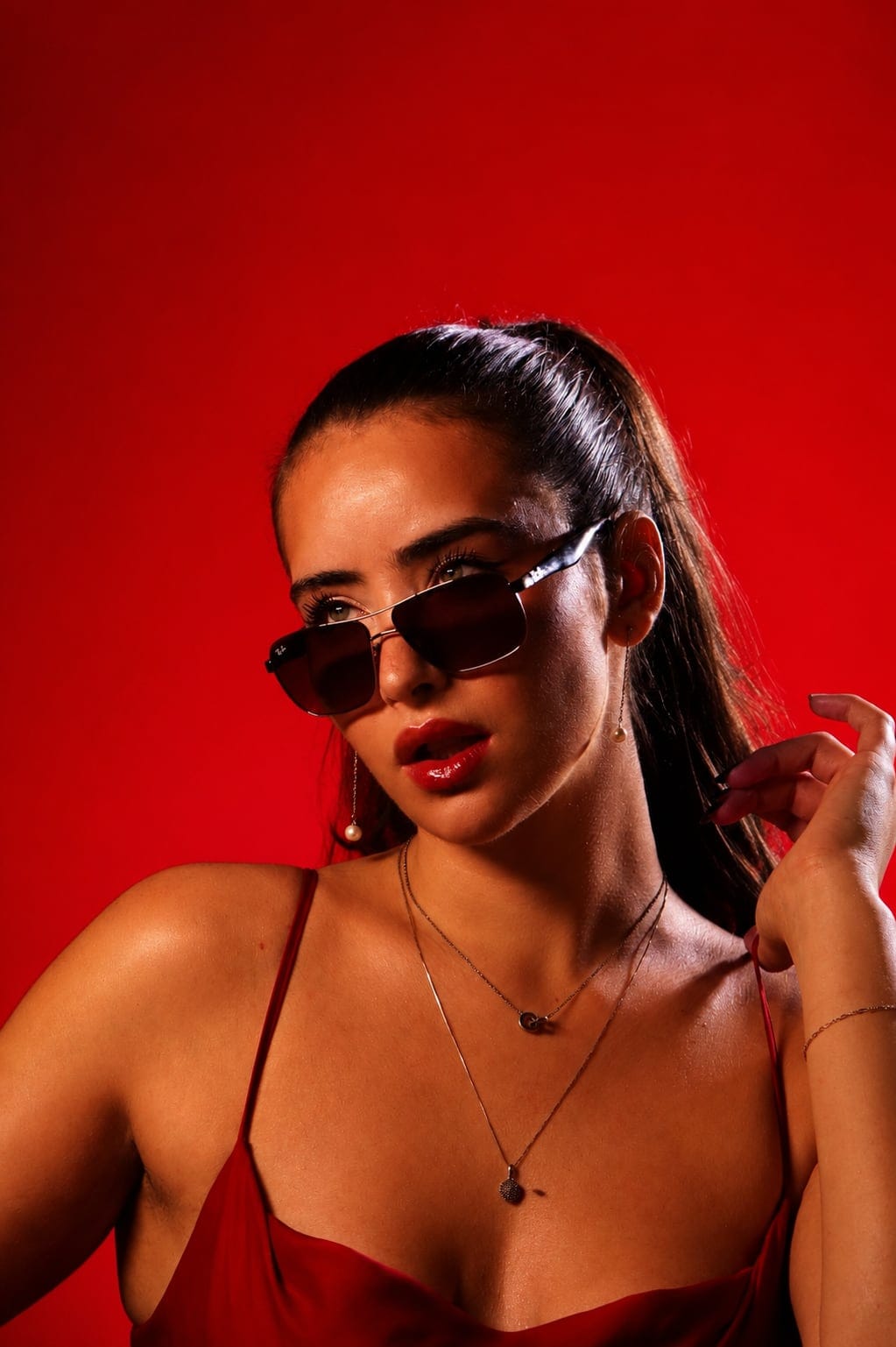 Red backdrop sunglasses portrait photographed at VibeShack Studios San Francisco