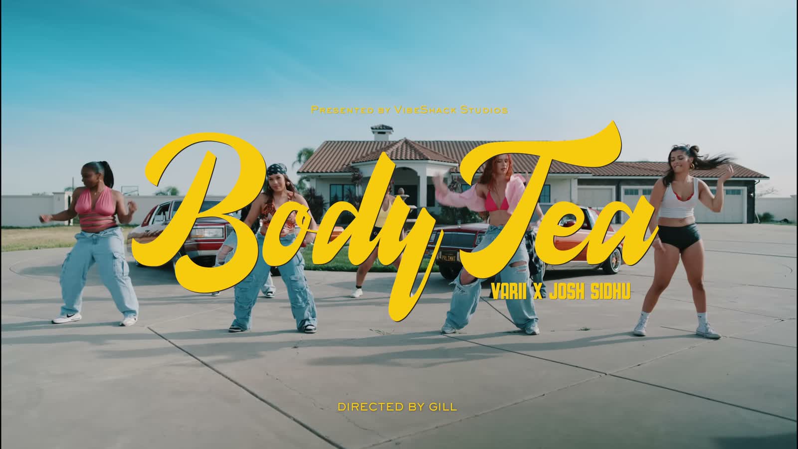 Body Is Tea music video title card with dancers in a sunny driveway