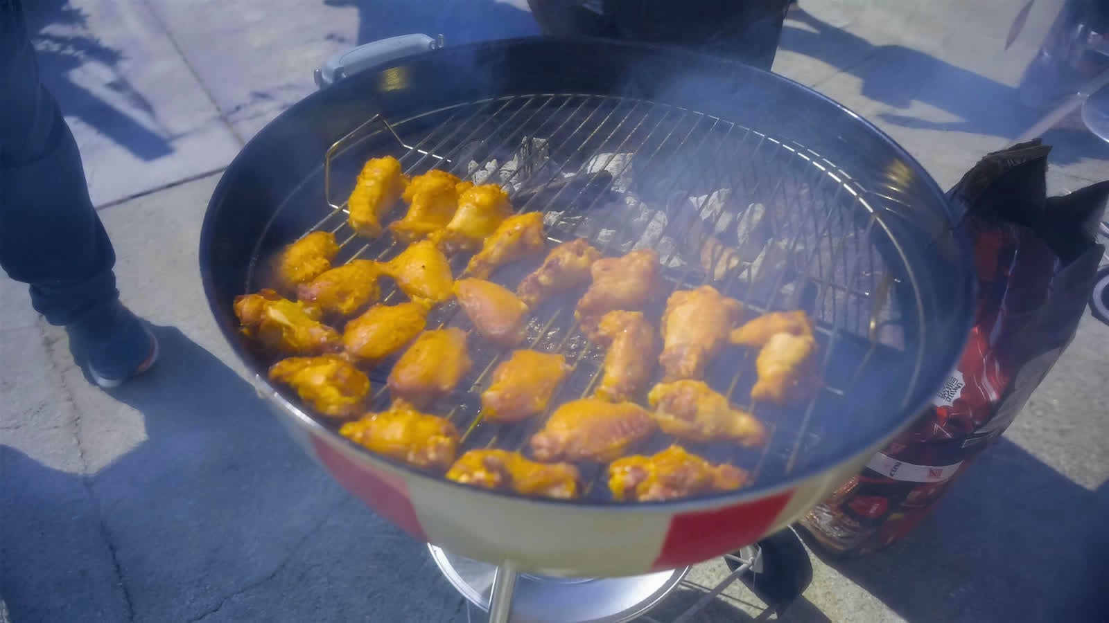 Hot wings tossed on a kettle grill at the Wing Battle event