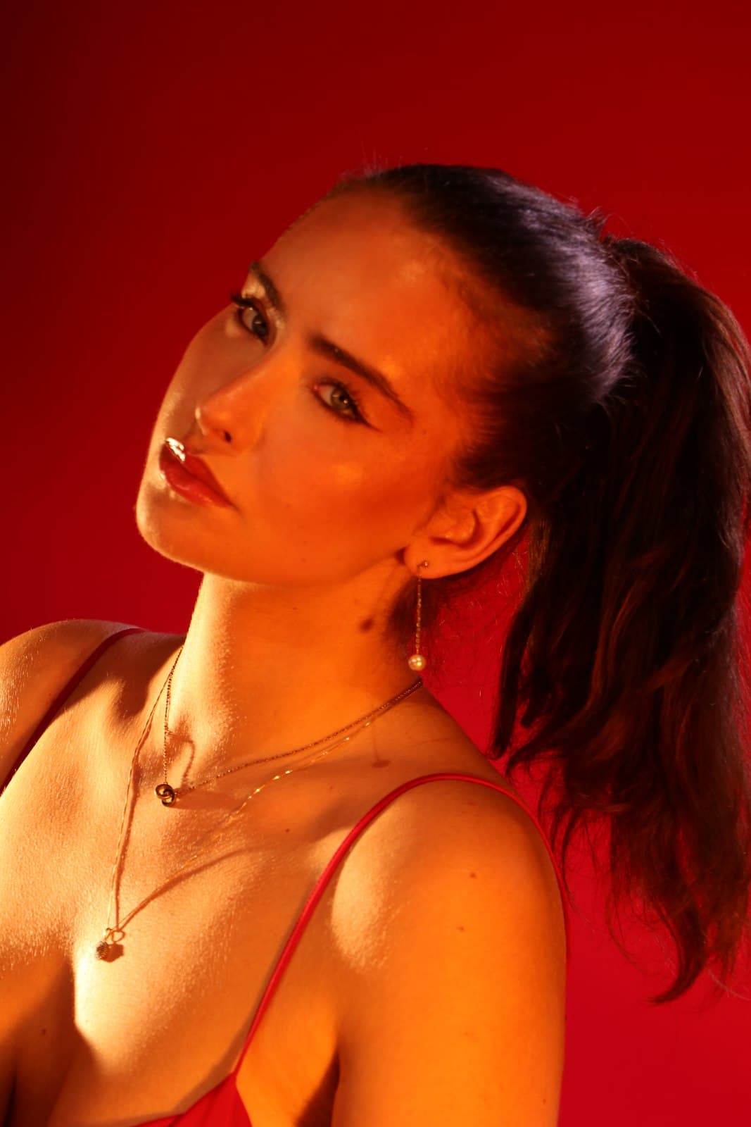 Red backdrop campaign portrait photographed at VibeShack Studios